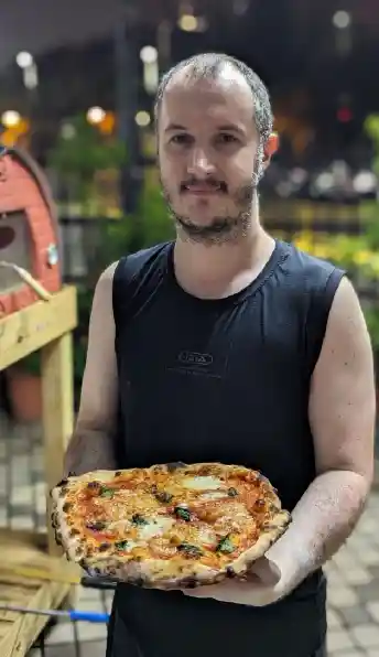 Ryan making pizza